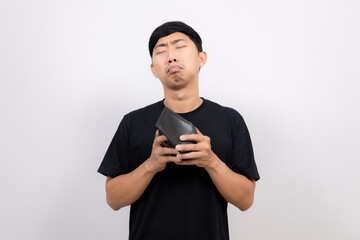 Asian man black shirt hold  no money wallet feel sad isolated