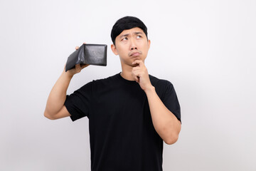 Asian man black shirt hold empty wallet feel sad gesture thinking about money isolated