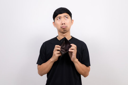 Asian man black shirt hold  no money wallet feel sad and looking up isolated
