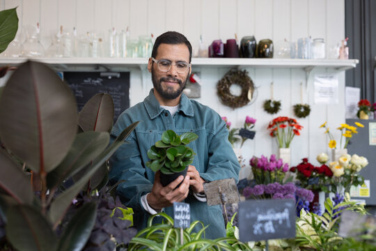 Man buying a plant in a store