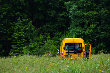 Camper autocaravan on a mountain meadow