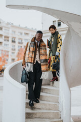 A diverse group of professional individuals descends stairs, showcasing modern style and...