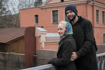 Smiling woman and man walking in the park. Beautiful young couple outdoors portrait