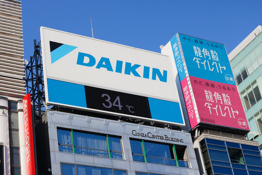 TOKYO, JAPAN - June 17, 2025: Daikin sign displaying the temperature on a very hot 34C day in June on the top of a building in Ginza.