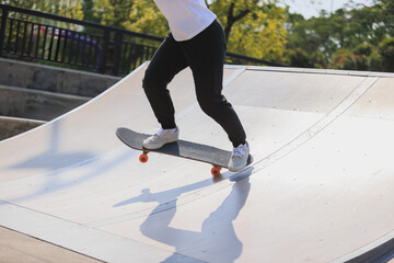 Skateboarder skateboarding at skatepark in city