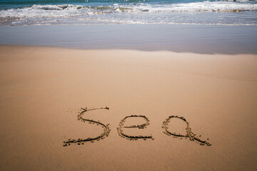 Sea word drawn on the beach
