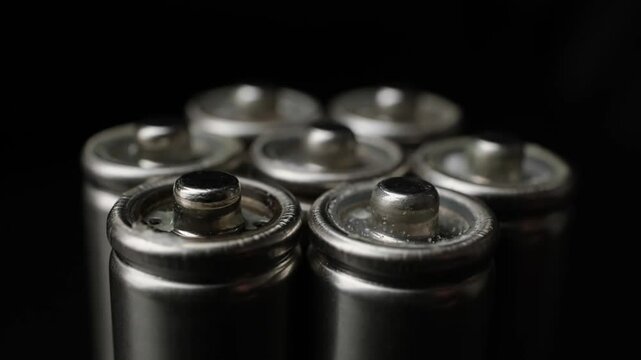 close-up of rotating metallic batteries clustered