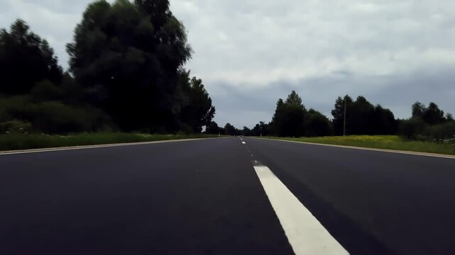 pov low angle view of driving on an open road