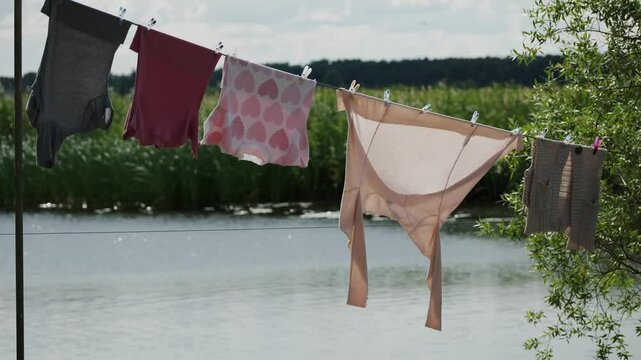 colorful clothes hanging on a line near peaceful