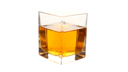 A clear glass cube filled with amber liquid against a white backdrop
