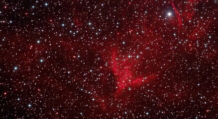 A view of the red nebulae in the night sky.