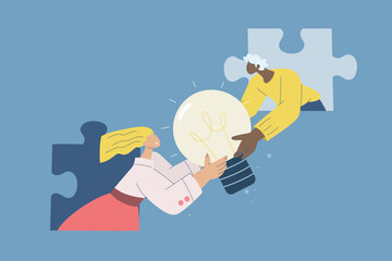 Teamwork solving puzzles, Lightbulb brainstorming, Team sharing of new ideas to solve organizational problems, Male and female employees holding lightbulbs together through jigsaw puzzle pieces.
