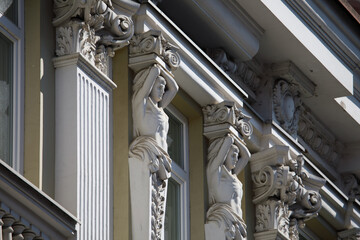Elegant Caryatid Sculptures Adorn Didžioji Street Building Facade