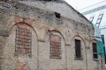 Historic Paupys Factory Wall: Arched Windows and Brickwork, Vilnius, Lithuania