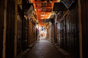 Fotobehang Smalle Straten Shops along the narrow streets in the Medina quarter of Fez el Bali, Fez, north west Morocco  © hyserb