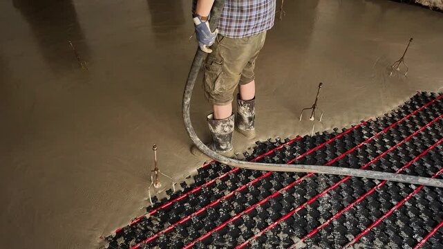 Concreting floors for underfloor heating. Concrete work in rooms with underfloor heated floors. A tools for creating a level surface. The concept of construction and building work