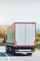 White truck driving on highway with shipment