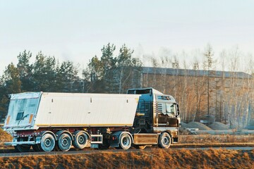 White cargo truck moving on paved road