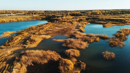 Aerial view of flooded quarry lake and terrain