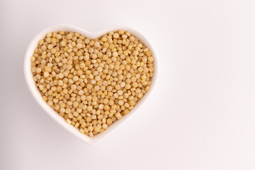 dry couscous isolated on white