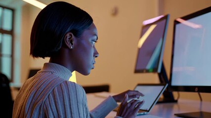 Focused black female data analyst working late at night - Powered by Adobe