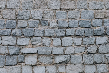 Obraz premium Rough Stone Wall Texture with Natural Grey Blocks