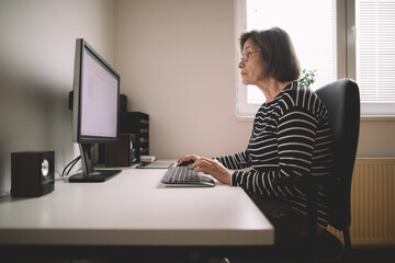 Senior woman working from home