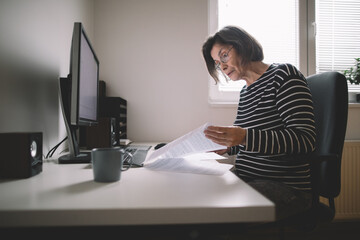 Senior woman checking documents