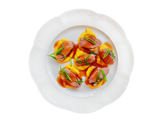 Turkey pieces with pumpkin garnish isolated dish on white background.