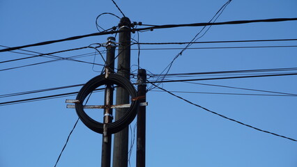 electrical wires and cables on poles