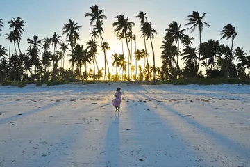 Fototapete Sansibar girl walking on a beach  © Anders