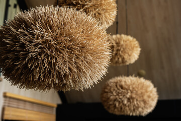 Hanging decorative straw spheres providing natural design and aesthetic texture indoors