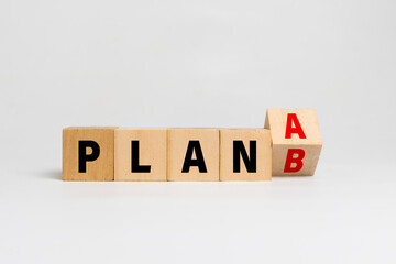 flip wooden blocks with plan a or b isolated on white background. concept of business strategy planning