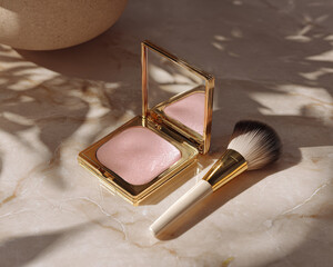 Flat lay of blush compact with brush on marble surface, showcasing elegance and beauty. soft pink hue of blush complements luxurious gold packaging, creating serene atmosphere