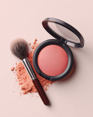 Realistic shot of blush compact in soft peach color, accompanied by makeup brush and scattered powder, evokes sense of beauty and elegance. composition highlights product texture and color