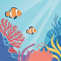Tropical clownfish swimming in a vibrant blue coral reef underwater