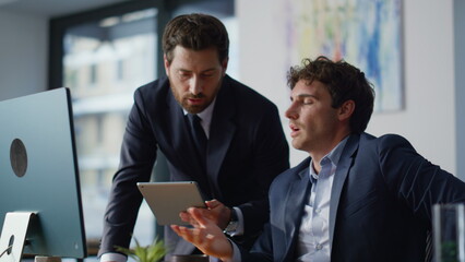 Professional mentor consulting man trainee holding tablet closeup. Business team