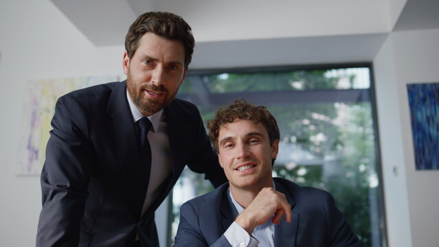 Office men talking virtual meeting using computer online at coworking pov view