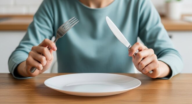 Empty White Plate with Fork and Knife Waiting for Meal Anticipation Concept