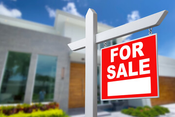 Home For Sale Real Estate Sign and Beautiful New House.