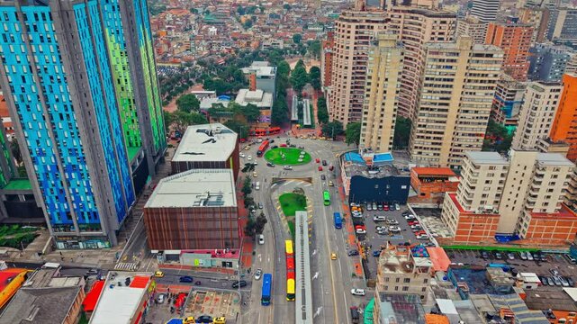 Aerial view of the cinematheque in Bogota, Colombia with residential buildings in the city center with a traffic circle.