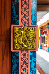 Elaborate gold sculptures and vibrant colors adorn the columns of Sri Maha Mariamman Temple, reflecting the rich cultural heritage of Kuala Lumpur, Malaysia