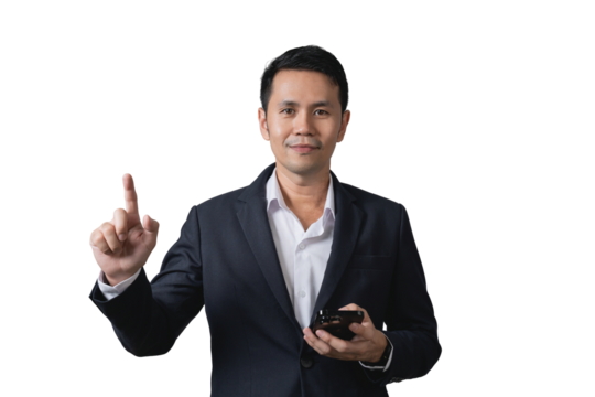 Confident businessman in formal attire shows finger gesture while holding smartphone, representing communication and modern technology in business context.