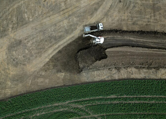 preparation of highway construction. soil removal from fields. transportation and leveling of...