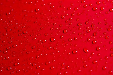 Water Droplets on a Surface Abstract Red Background