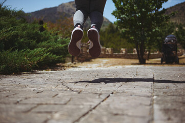 Dynamic Action Shot of a Person Jumping Outdoors Against Nature