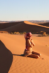 beautiful woman in the desert dunes