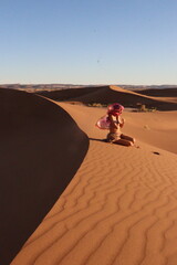 beautiful woman in the desert dunes