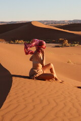 beautiful woman in the desert dunes