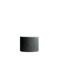 Minimalist still life of a textured gray cylinder against a dark background